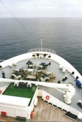 At sea under partially cloudy skys